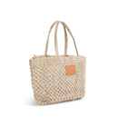 Petite Mercado Tote in Natural — three-quarter view showing the open weave and crocheted handles