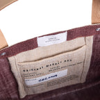 Petite Market Bag in Mulberry — interior and artisan label