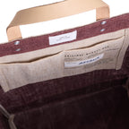 Market Bag in Mulberry — interior and artisan label
