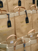 Gold Foil Collection: Timeless natural jute elevated with hand-pressed gold lettering. Effortlessly elegant and durable—crafted for gatherings, gifting, and everyday carry with understated California sophistication