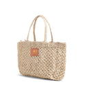 Petite Mercado Tote in Natural — three-quarter view from the opposite side, gold foil monogram on the leather patch