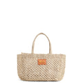Petite Mercado Tote in Natural — handwoven open-weave jute tote, front view with gold foil monogram on the leather patch