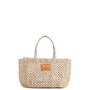 Petite Mercado Tote in Natural — handwoven open-weave jute tote, front view with gold foil monogram on the leather patch