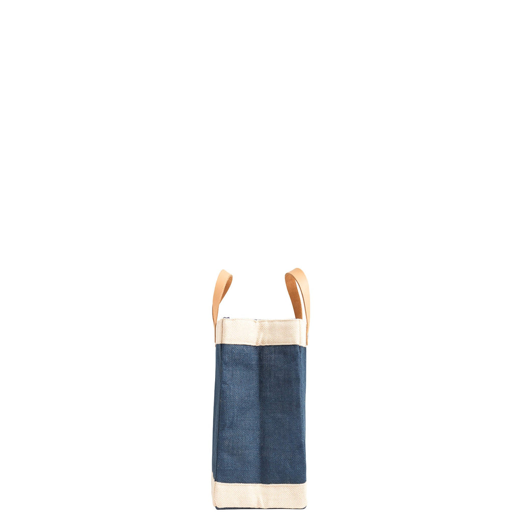 Generic Navy Petite Market Bag side profile with cream trim and light leather handles.