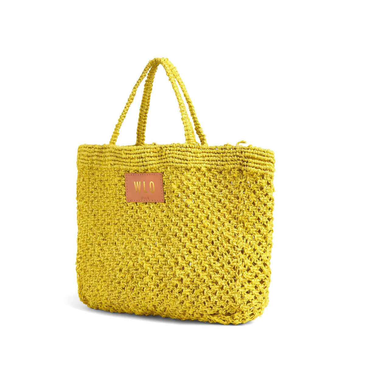 Petite Mercado Tote in Ocre — three-quarter view from the opposite side, gold foil monogram on the leather patch